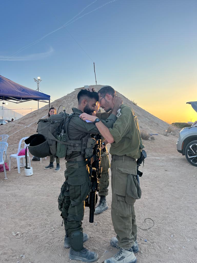 Rabbi Avichai Epstein blessing a soldier before entering Gaza