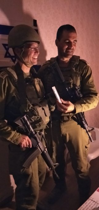 Rabbi Avichai Epstein giving a mezuzah to Colonel Ivri Elbaz